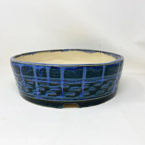 10.75″ Handmade Pot by the Pot Punching Potters (PPP11)