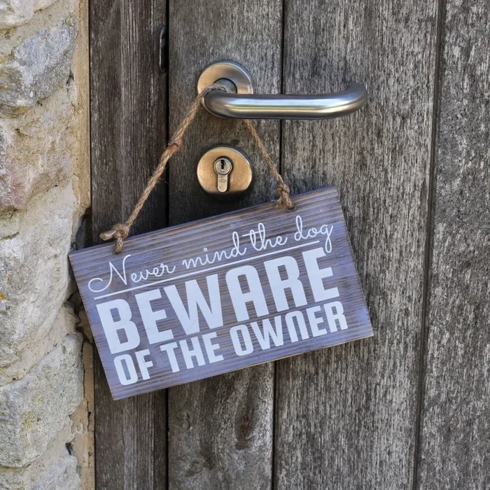 Beware of the Owner Hanging Sign